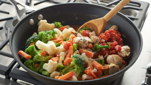 Cooking vegetables in a pan.
